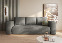 Modern LAMBI sofa bed in boucle fabric in stylish living room.