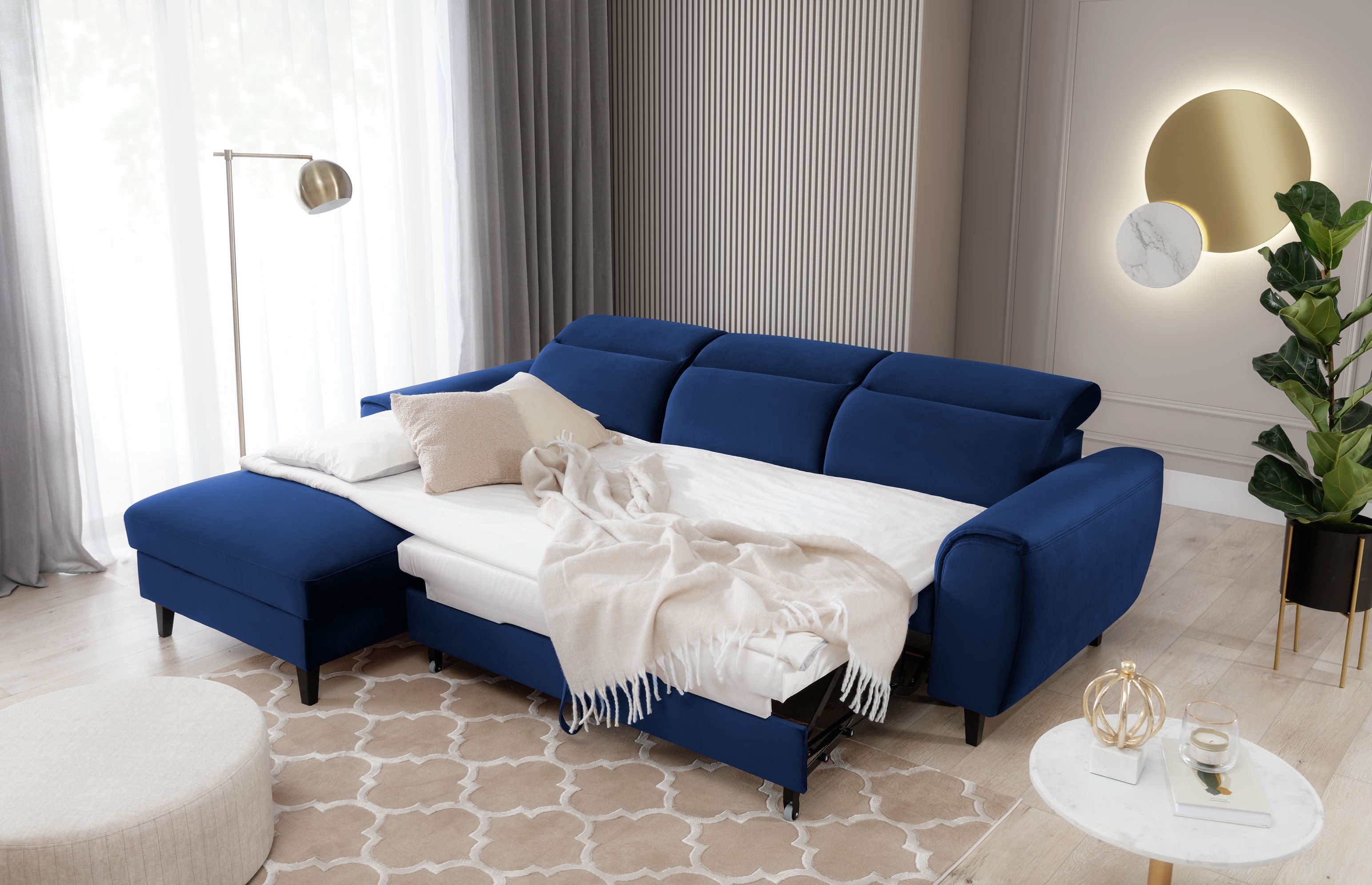 Luxurious blue FOBLE Corner Sofa Bed in a modern living room setting.
