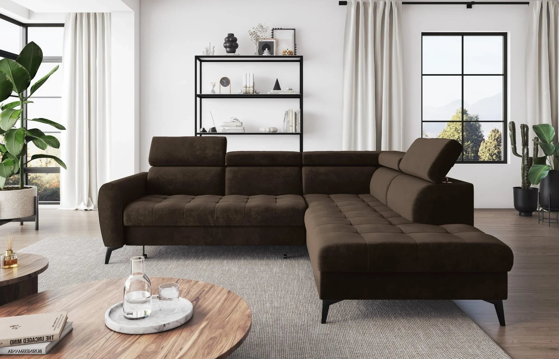 BJORN L corner sofa bed in a modern living room with adjustable headrests and quilted seats, featuring high metal legs.
