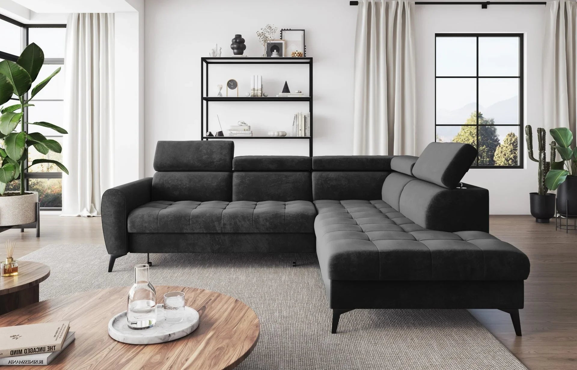 BJORN L Corner Sofa Bed in modern living room setting, featuring black velour fabric, quilted seats, adjustable headrests, and metal legs.