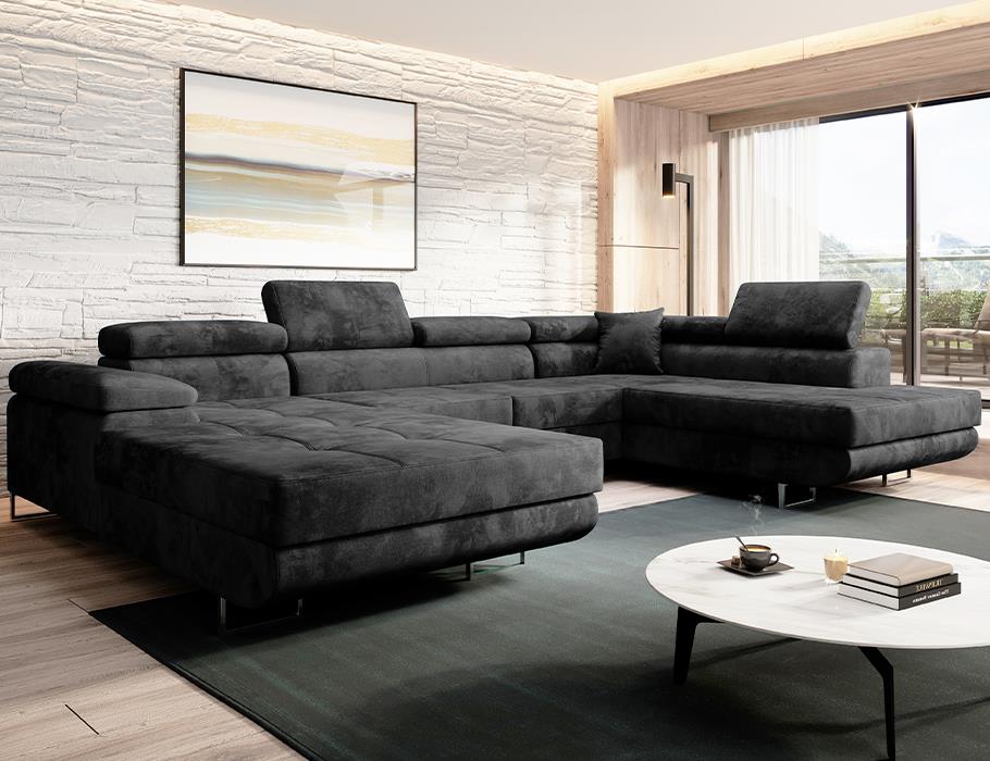 Luxurious VARBERG U-corner sofa in velvet fabric with headrests in a stylish living room setting.