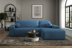 Modern blue Tori Corner Sofa with cloud fabric upholstery and decorative cushions in a bright living room