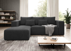 STRIPES Corner Sofa Bed in black corduroy in modern living room setting.