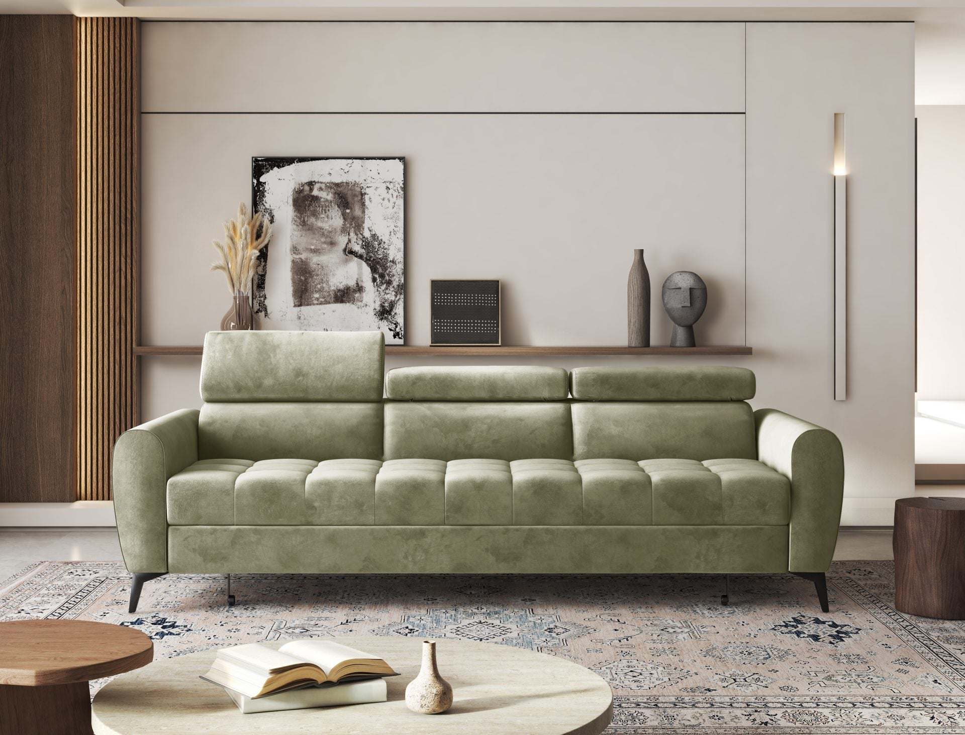Modern green BJORN sofa bed with adjustable headrests in a stylish living room setting.