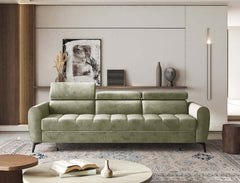Modern green BJORN sofa bed with adjustable headrests in a stylish living room setting.