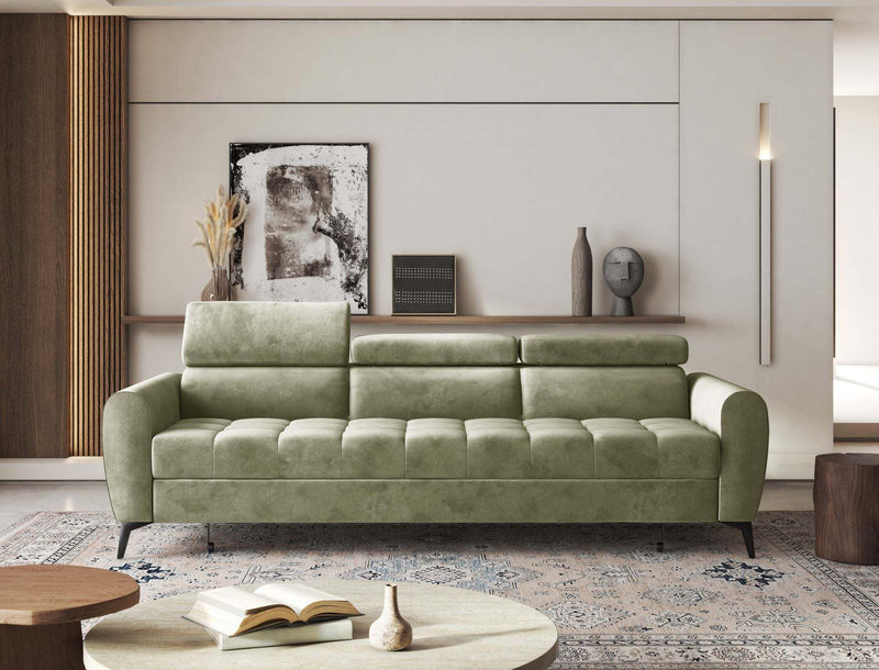 Modern green BJORN sofa bed with adjustable headrests in a stylish living room setting.