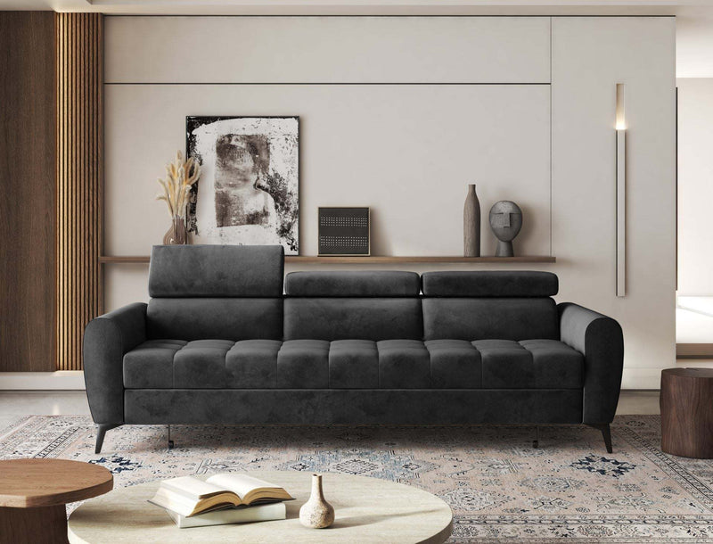 BJORN Sofa Bed in dark fabric with adjustable headrests, in a modern living room setting.
