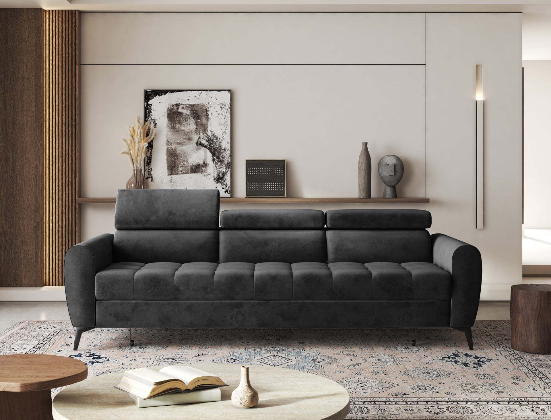 BJORN sofa bed in a modern living room setting with adjustable headrests and sleek design.