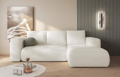 LAMBI corner sofa bed in a cozy living room setting with neutral tones.