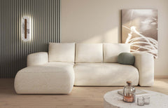 LAMBI corner sofa bed in multicolored fabric, modern living room setting.