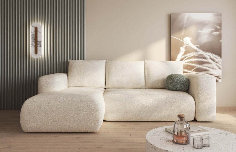 LAMBI corner sofa bed in multicolored fabric, modern living room setting.